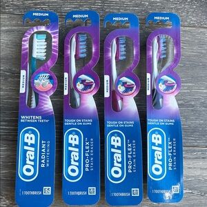 Lot of 4 NEW Oral-B Medium Bristles Toothbrushes